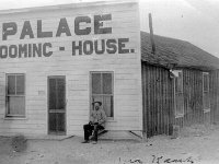 FAIRVIEW-MR KENT-PALACE ROOMING HOUSE-PH268-10  Mr. Kent lounging in front of The Palace - Courtesy the Churchill County Museum