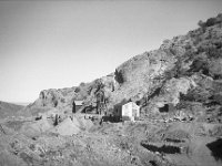 d3s71c  Henchey, Paul L. Abandoned Mine Shaft and Buildings, Tybo, Nevada, SV-330. UC Davis Library, Archives and Special Collections, 8 Oct. 1951. digital.ucdavis.edu
