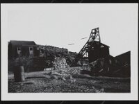 Abandoned buildings, mining head frame, and decayed structures at Johnnie Mine.   Abandoned buildings and head frame at Johhnie Mine, courtesy UNLV