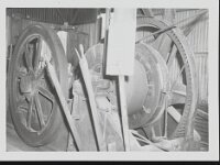 Close up image of rope-pulley machinery inside Johnnie Mine.  Rope pulley machine at Johnnie, some time during the 1940's or 1950's, courtesy UNLV