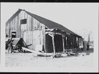 Old wood barn-like shed structure, possibly abandoned, in Johnnie, Nevada.  Barn-like shed structure, taken during 1940's or 1950's, courtesy UNLV