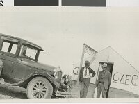 UNLV Fred Hesse and Spud Lake stand outside of the Gold Bar Club next to an automobile.  Hold the camera level, dammit. Courtesy UNLV