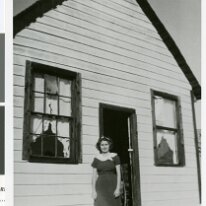 pho023115 A close-up of Alberta Chloe Calvin in front of a schoolhouse. The schoolhouse had only two students.
